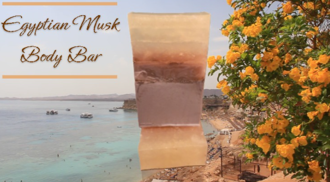 Handmade organic Egyptian Musk body bar 𓂀 with golden triple butter swirl and lime zest flecks, regal gold mica on obsidian stone, ancient luxury spa vibe