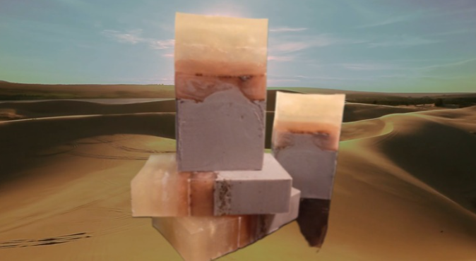 Handmade organic Egyptian Musk body bar 𓂀 with golden triple butter swirl and lime zest flecks, regal gold mica on obsidian stone, ancient luxury spa vibe