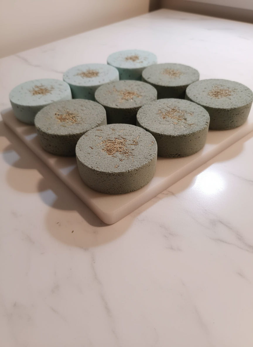 Handmade organic eucalyptus shower steamers in eco-friendly packaging, vibrant green hue from natural oils, aromatic spa-like bathroom essential