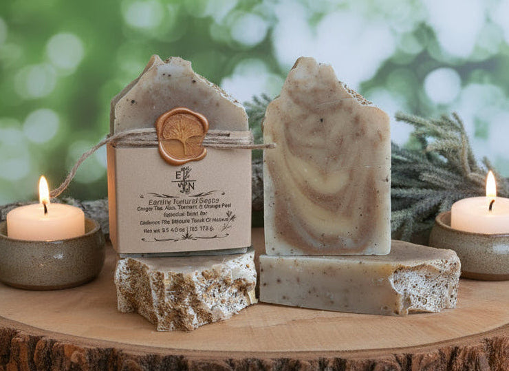 Rich golden lather from turmeric ginger soap in hands, creamy foam with visible orange peel and tea flecks