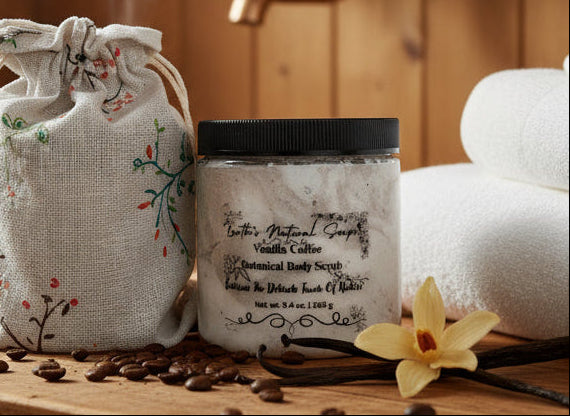 Close-up of handmade organic vanilla coffee whipped sugar scrub in a jar with coffee beans and vanilla pods, creamy texture, natural skincare exfoliant

